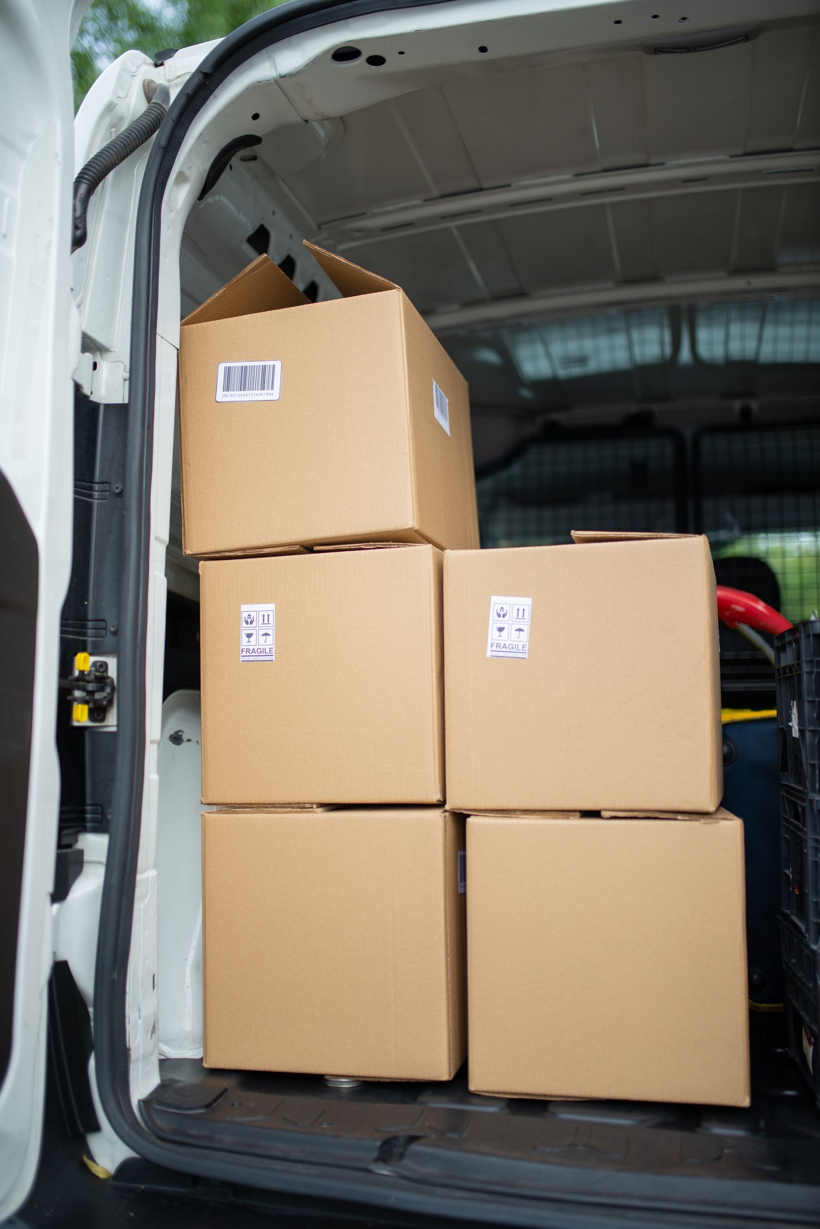 Cardboard boxes stacked inside a van