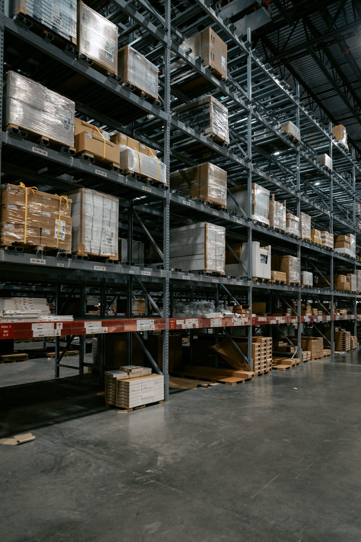 Warehouse racking stacked with boxes on pallets