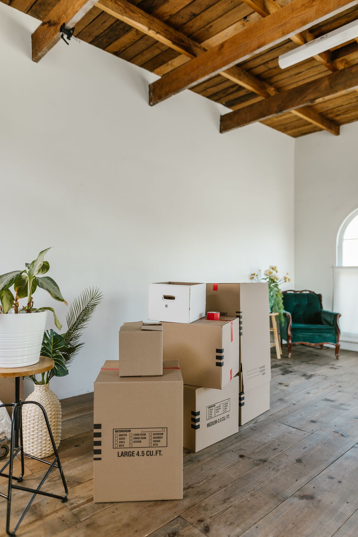 Moving boxes stacked in an empty room